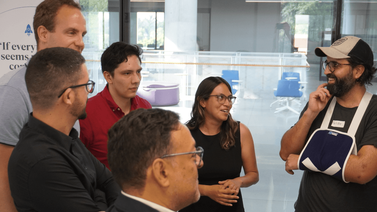 Felipe discussing the programme with fellow members of the CATAL1.5°T Latin America Team